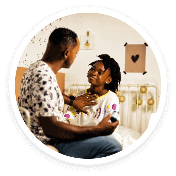 A dad rubbing Glacial Rub Up on his daughter. A dad rubbing Glacial Rub Up on his daughter.